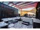 Relaxing rooftop deck with lounge furniture, modern pergola, hot tub, and stylish outdoor rug at 3030 Wilson Ct # 5, Denver, CO 80205