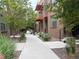Landscaped walkway between modern townhomes with well-maintained greenery at 3030 Wilson Ct # 5, Denver, CO 80205