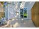 Concrete back patio with sliding glass door and privacy fence at 9320 W Ontario Dr, Littleton, CO 80128