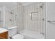 A full bath, featuring a modern shower over tub and a toilet at 9320 W Ontario Dr, Littleton, CO 80128