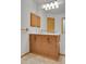 Bathroom showcasing a dual-sink vanity and mirror at 9320 W Ontario Dr, Littleton, CO 80128