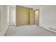 A bedroom with a window and closet, natural paint and carpet at 9320 W Ontario Dr, Littleton, CO 80128