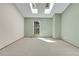 Spacious bedroom featuring skylights and a large window at 9320 W Ontario Dr, Littleton, CO 80128