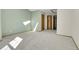 Spacious carpeted bedroom with natural light and access to the hall at 9320 W Ontario Dr, Littleton, CO 80128