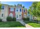Inviting townhome with a well-manicured lawn and a charming, colorful facade at 9320 W Ontario Dr, Littleton, CO 80128