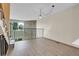 Open floor plan loft area with stone accent wall and hardwood floors at 9320 W Ontario Dr, Littleton, CO 80128