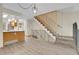 Inviting living space featuring hardwood floors and a staircase at 9320 W Ontario Dr, Littleton, CO 80128