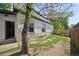 Charming backyard featuring a well-maintained lawn with unique stone pathways and a partial fence at 3817 Osage St, Denver, CO 80211