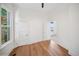 Bright, airy bedroom with natural hardwood floors and plenty of natural light with multiple windows at 3817 Osage St, Denver, CO 80211