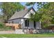 This angle on the home shows the well manicured lawn and architectural details of the structure at 3817 Osage St, Denver, CO 80211
