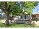 Charming home with a well-maintained front yard and inviting curb appeal, including mature tree coverage at 3817 Osage St, Denver, CO 80211