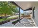 Inviting covered porch with concrete flooring, offering a relaxing outdoor space and great views of the neighborhood at 3817 Osage St, Denver, CO 80211
