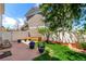 A private backyard with a patio, a manicured lawn and tasteful landscaping at 5570 Perth Ct, Denver, CO 80249