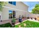 Enclosed backyard featuring concrete patio and healthy green lawn at 5570 Perth Ct, Denver, CO 80249