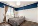 Bedroom featuring a large window, neutral decor, and hardwood floors at 5570 Perth Ct, Denver, CO 80249