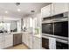 Well-equipped kitchen featuring stainless steel appliances and ample white cabinetry at 5570 Perth Ct, Denver, CO 80249
