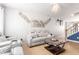 Bright living room featuring modern furnishings and neutral decor, perfect for relaxation and entertaining at 5570 Perth Ct, Denver, CO 80249