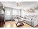 Inviting living room with modern sofa and light colored walls, great for entertaining and conversation at 5570 Perth Ct, Denver, CO 80249