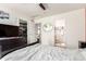 Bedroom features a walk-in closet, ensuite bathroom entrance, and a TV with a dresser at 5570 Perth Ct, Denver, CO 80249