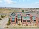 A high aerial shot of townhouses, showcasing the neighborhood and landscape in the background at 5471 W 97Th Pl # E, Broomfield, CO 80020