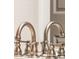 Bathroom detail of a double vanity with brushed bronze faucet fixtures at 5471 W 97Th Pl # E, Broomfield, CO 80020