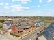 Brick townhouses with rooftop patios and modern exteriors offer stylish living spaces in a desirable location at 5471 W 97Th Pl # E, Broomfield, CO 80020