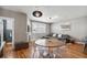 Comfortable living space featuring hardwood floors, a fireplace, a large window and a contemporary open-concept design at 5471 W 97Th Pl # E, Broomfield, CO 80020