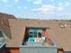 Inviting rooftop patio features comfortable seating, providing residents with relaxation and outdoor enjoyment at 5471 W 97Th Pl # E, Broomfield, CO 80020