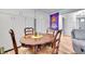 Finished basement area features a dining table and chair set and extra storage at 55 S Flower St, Lakewood, CO 80226
