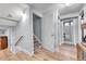 Hallway in finished basement leads to a bedroom and a finished storage room at 55 S Flower St, Lakewood, CO 80226