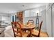Finished basement area features a dining table and chair set and a couch at 55 S Flower St, Lakewood, CO 80226
