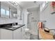 Bathroom featuring glass shower, vanity and updated lighting at 55 S Flower St, Lakewood, CO 80226