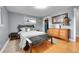 Well-lit bedroom featuring hardwood floors, a queen sized bed and a walk-in closet at 55 S Flower St, Lakewood, CO 80226