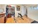 Bright bedroom featuring hardwood floors, a closet, and an exercise machine at 55 S Flower St, Lakewood, CO 80226