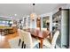 Spacious dining room featuring hardwood floors, stylish decor and seating for six at 55 S Flower St, Lakewood, CO 80226