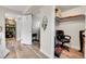 Hallway offers view to Kitchen and closet space with vinyl flooring throughout at 55 S Flower St, Lakewood, CO 80226