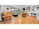 Comfortable living room featuring hardwood floors, a fireplace, and built-in bookshelves at 55 S Flower St, Lakewood, CO 80226