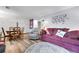 Comfortable living room features a couch, a recliner, and a dining set in the corner at 55 S Flower St, Lakewood, CO 80226