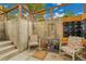 Outdoor patio area with colorful chairs and decor, perfect for relaxing at 55 S Flower St, Lakewood, CO 80226