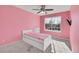 Pink bedroom featuring a large window and a modern bed at 298 Hampstead Ave, Castle Rock, CO 80104