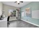 Bright home office with gray wood floors, world maps, and a built-in bookshelf for optimal organization at 298 Hampstead Ave, Castle Rock, CO 80104