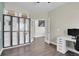 Spacious office featuring ample storage with built-in shelving and a modern white desk setup at 298 Hampstead Ave, Castle Rock, CO 80104