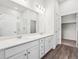 Bathroom featuring double vanity, modern lighting, and glass shower at 485 Interlocken Blvd # 101, Broomfield, CO 80021