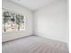 Bedroom with carpet and large window allowing natural light at 485 Interlocken Blvd # 101, Broomfield, CO 80021