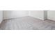 Spacious bedroom with a neutral carpet, and white walls at 485 Interlocken Blvd # 101, Broomfield, CO 80021