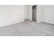 Spacious bedroom with a closet, carpet and neutral paint at 485 Interlocken Blvd # 101, Broomfield, CO 80021