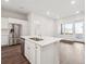 Kitchen with stainless steel refrigerator, center island, and natural light at 485 Interlocken Blvd # 101, Broomfield, CO 80021