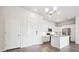 Modern kitchen featuring stainless steel appliances, island, and white cabinetry at 485 Interlocken Blvd # 101, Broomfield, CO 80021