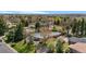 Overhead shot of the property, with mature landscaping and nearby street at 5471 S Sherman St, Littleton, CO 80121
