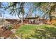 Beautiful backyard features a lush lawn, garden area, and a charming gazebo at 5471 S Sherman St, Littleton, CO 80121